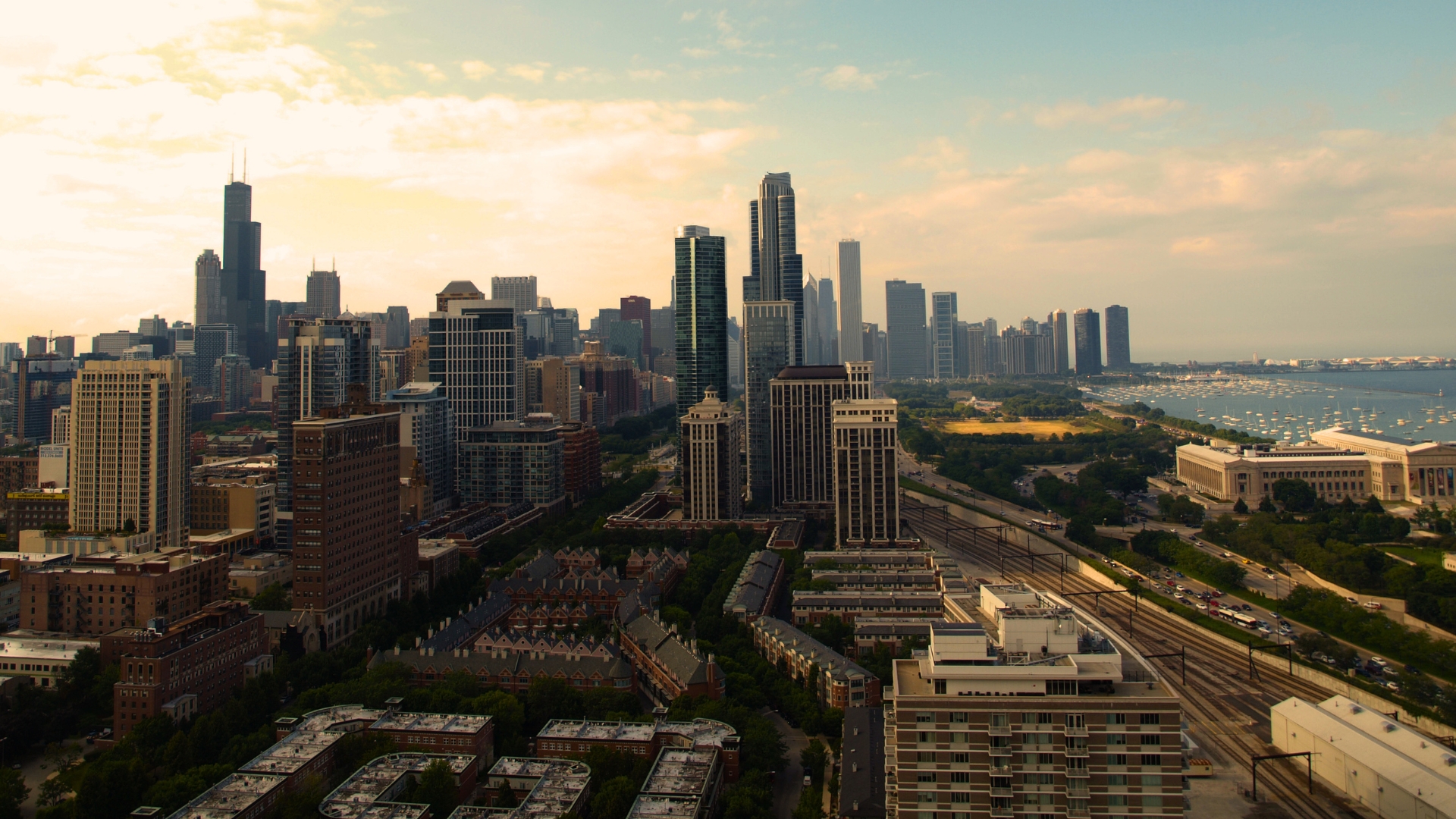 Aerial view of downtown Chicago skyline along Lake Michigan, with Willis Tower and Museum Campus visible