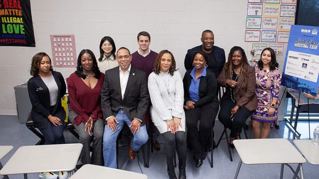 Group photo of community leaders and partners at the South Shore Housing Fair, hosted in partnership with the University of Chicago Office of Civic Engagement